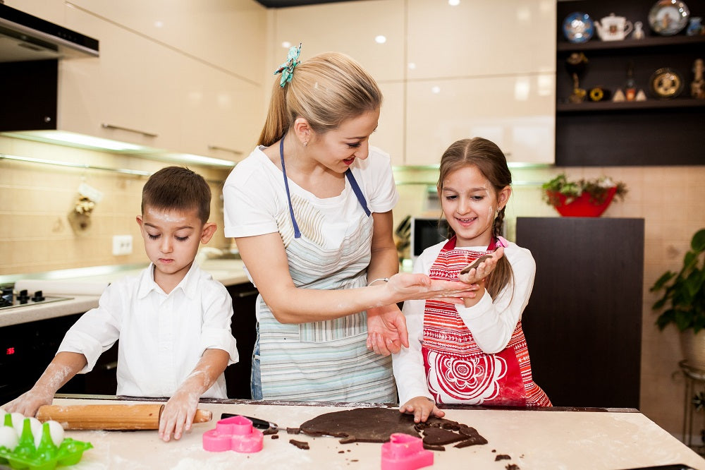 Premium Photo  Baking family and children with a mother and daughter  learning about cooking in the kitchen of their home food kids and help with  a girl and woman teaching her